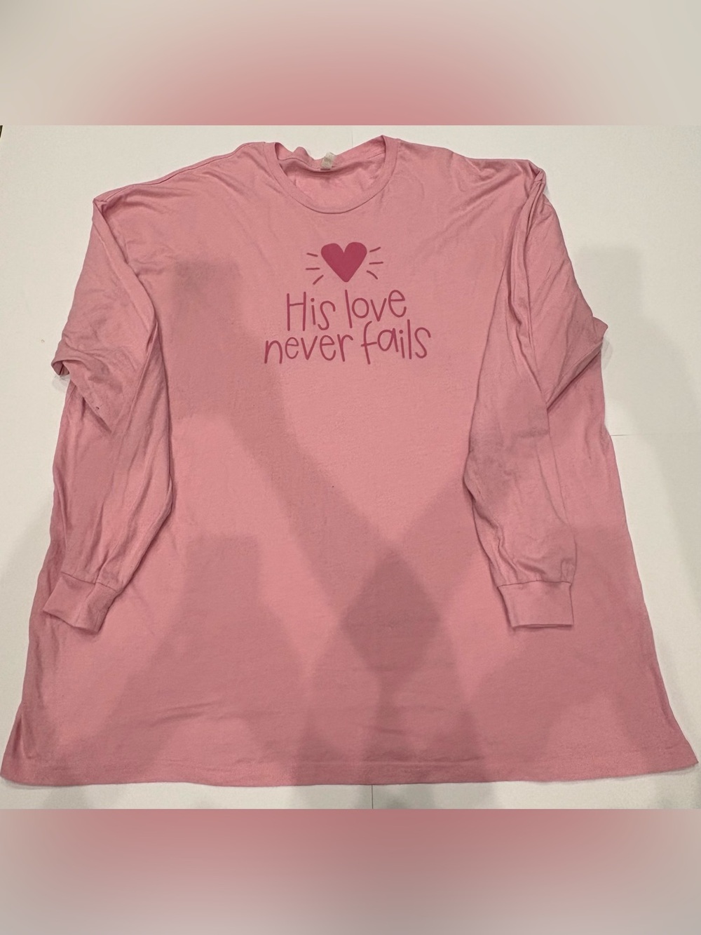 Pink Long-Sleeve Shirt - "His Love Never Fails"
